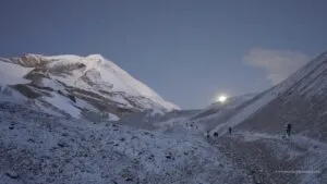 Walking with Moon light during Annapurna circuit trek near Thorong La 